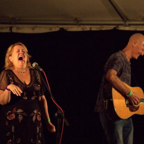 Photo showing Kip and Dave laughing on stage