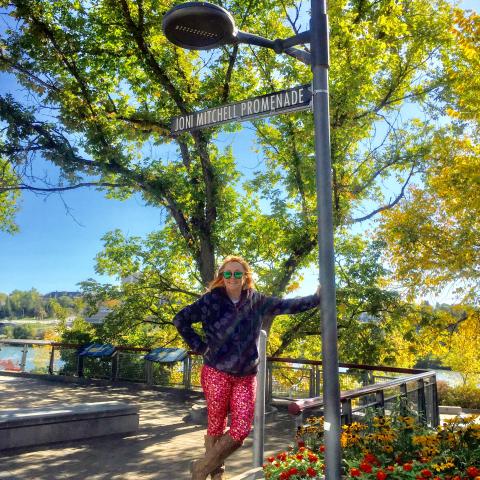 Kip at the sign for Joni Mitchell Boulevard 
