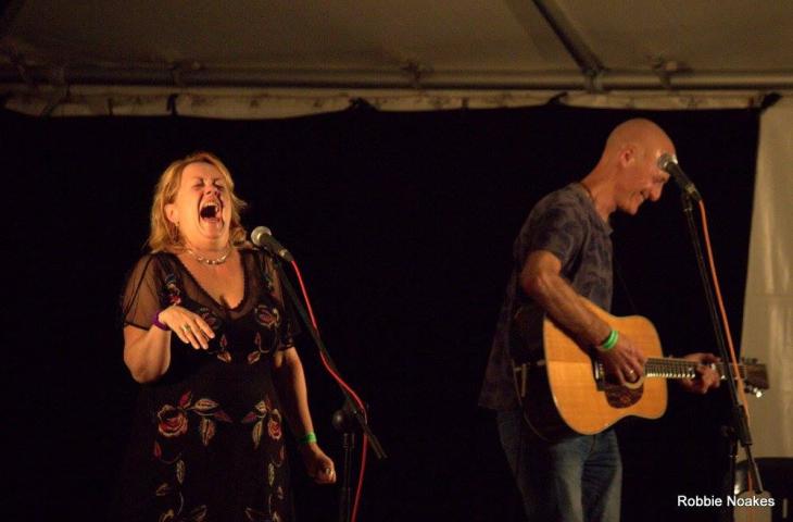 Photo showing Kip and Dave laughing on stage