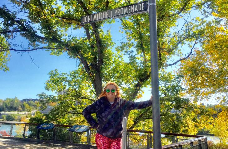 Kip at the sign for Joni Mitchell Boulevard 